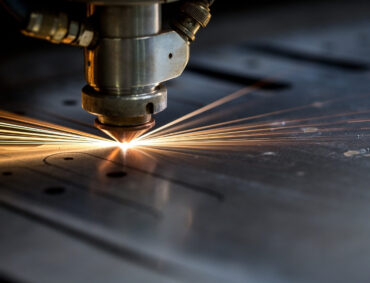 Cutting,Of,Metal.,Sparks,Fly,From,Laser